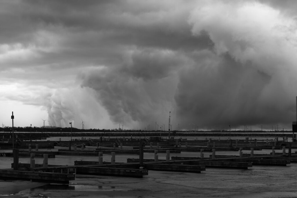 Storm clouds gathering over a marina